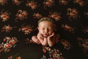 newborn session in Centralia, IL studio session, baby girl, foliage, froggy pose, floral backdrop, olive green