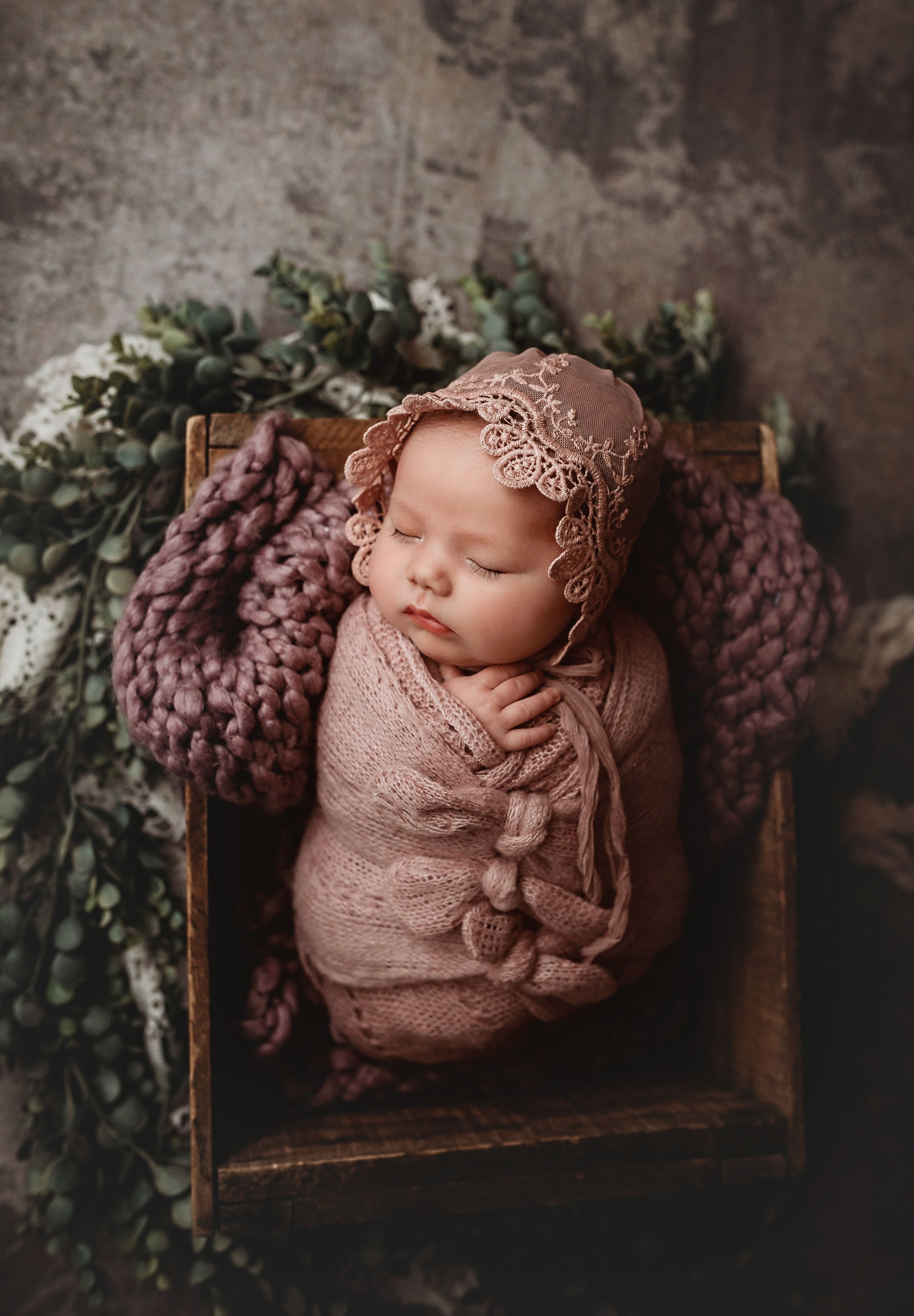 newborn session in Centralia, IL studio session, baby girl, foliage, wrapped