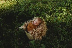 newborn session in Centralia, IL studio session, outdoor boy, foliage, wrapped