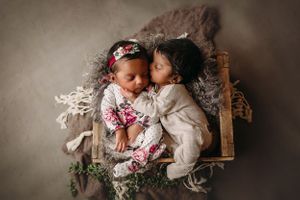 newborn session in Centralia, IL studio session, baby girl and boy, siblings, foliage, wrapped